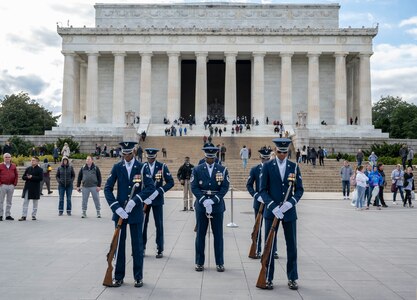 Members of The United States Air Force Honor Guard Drill Team compete in a 4-Member Drill during the Joint Services Drill Exhibition Oct. 19, 2022, at the Lincoln Memorial Plaza, Washington, D.C. The Honor Guard Drill Team’s mission is to promote the Air Force mission by showcasing drill performances at public and military venues to recruit, retain and inspire Airmen. (U.S. Air Force photo by Jason Treffry)