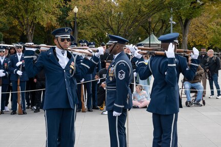 Members of The United States Air Force Honor Guard Drill Team compete in a 4-Member Drill during the Joint Services Drill Exhibition Oct. 19, 2022, at the Lincoln Memorial Plaza, Washington, D.C. During this exhibition, teams compete for the most superlative display of precision, mastery, discipline and teamwork as they undertake simultaneous ceremonial maneuvers. (U.S. Air Force photo by Jason Treffry)