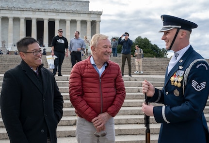 Claude Su (left), Kenneth Allan Goss (center) and U.S. Air Force Staff Sgt. Robert Day of The United States Air Force Honor Guard Drill Team, talk after the Honor Guard Drill Team’s performance at the Joint Services Drill Exhibition on Oct. 19, 2022, at the Lincoln Memorial Plaza in Washington, D.C. This was the first Joint Services Drill Exhibition in ten years. (U.S. Air Force photo by Jason Treffry)