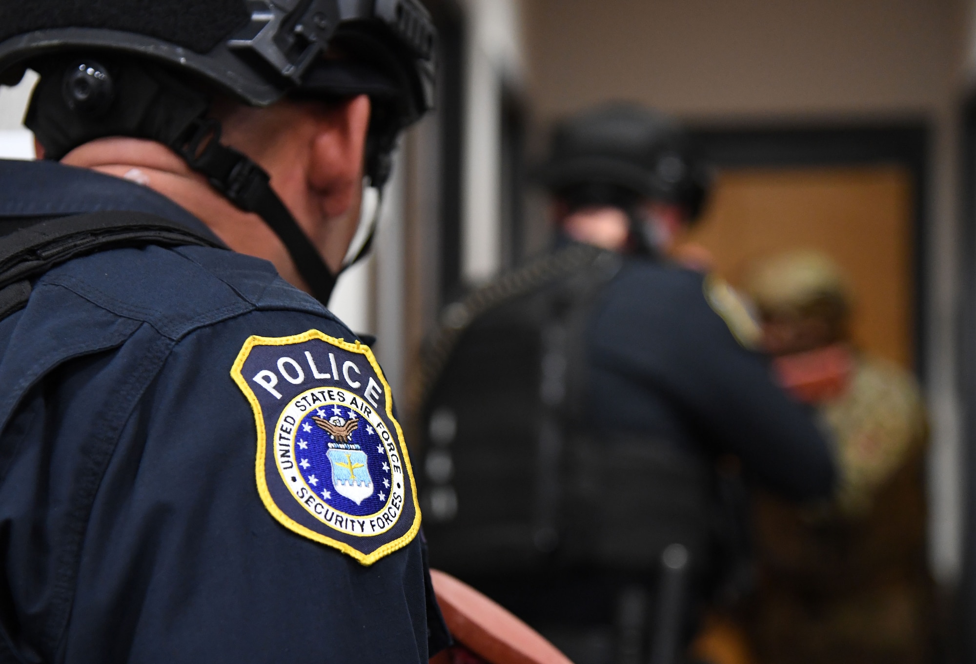 Members of the 81st Security Forces Squadron clear rooms during an active shooter exercise inside the Levitow Training Support Facility at Keesler Air Force Base, Mississippi, Oct. 20, 2022.