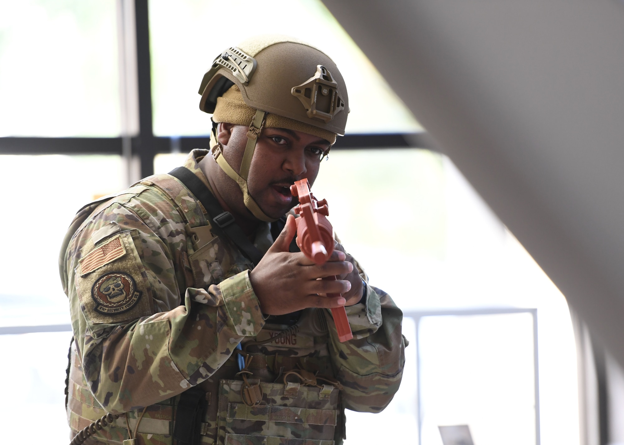 U.S. Air Force Tech. Sgt. Brandon Young, 81st Security Forces Squadron flight sergeant, secures the building during an active shooter exercise inside the Levitow Training Support Facility at Keesler Air Force Base, Mississippi, Oct. 20, 2022.