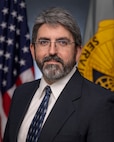 Richard Baughman, U.S. Army Financial Management Command Audit Response Center accountant, poses for an official photo at the Maj. Gen. Emmett J. Bean Federal Center in Indianapolis Oct. 19, 2022. Baughman was awarded the 2021 Louis Dellamonica Award for Outstanding U.S. Army Materiel Command Personnel of the Year. (U.S. Army photo by Mark R. W. Orders-Woempner)