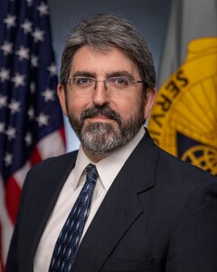 Richard Baughman, U.S. Army Financial Management Command Audit Response Center accountant, poses for an official photo at the Maj. Gen. Emmett J. Bean Federal Center in Indianapolis Oct. 19, 2022. Baughman was awarded the 2021 Louis Dellamonica Award for Outstanding U.S. Army Materiel Command Personnel of the Year. (U.S. Army photo by Mark R. W. Orders-Woempner)