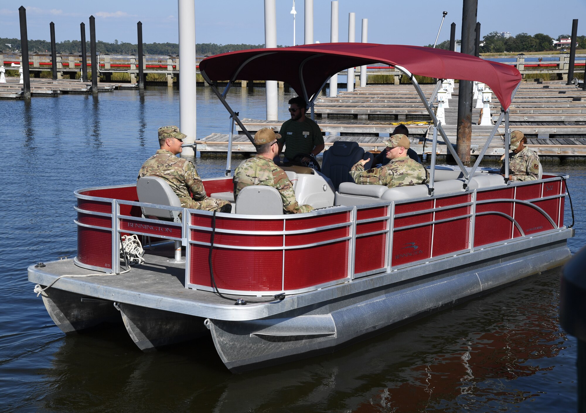 Keesler personnel take a pontoon boat ride during the fuel pier ribbon cutting ceremony at the marina park at Keesler Air Force Base, Mississippi, Oct. 21, 2022.