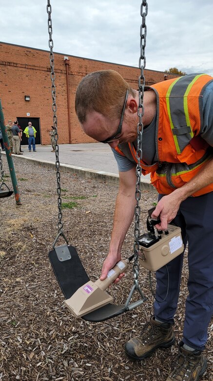 USACE St. Louis District Formerly Utilized Sites Remedial Action Program contractor collects measurements from the Jana Elementary School playground equipment.  Sampling began Monday, Oct. 24, and preliminary results will be available within two weeks. (US Army Photo by JP Rebello)