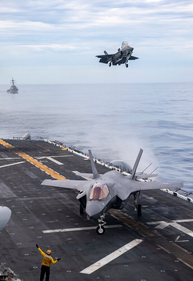 PACIFIC OCEAN (Sept. 4, 2022) - U.S. Marine Corps F-35B Lighting II pilots with Marine Fighter Attack Squadron (VMFA) 122, 13th Marine Expeditionary Unit, land aboard amphibious assault ship USS Makin Island (LHD 8), Sept. 4. A force in readiness, the 13th MEU trains to rapidly respond to crises in all domain environments through naval power projection. The Makin Island Amphibious Ready Group, comprised of amphibious assault ship USS Makin Island (LHD 8) and amphibious transport docks USS Anchorage (LPD 23) and USS John P. Murtha (LPD 26), is underway conducting integrated training operations with the 13th MEU in the U.S. 3rd Fleet to prepare for an upcoming deployment. (U.S. Marine Corps photo by Cpl. Carl Matthew Ruppert)