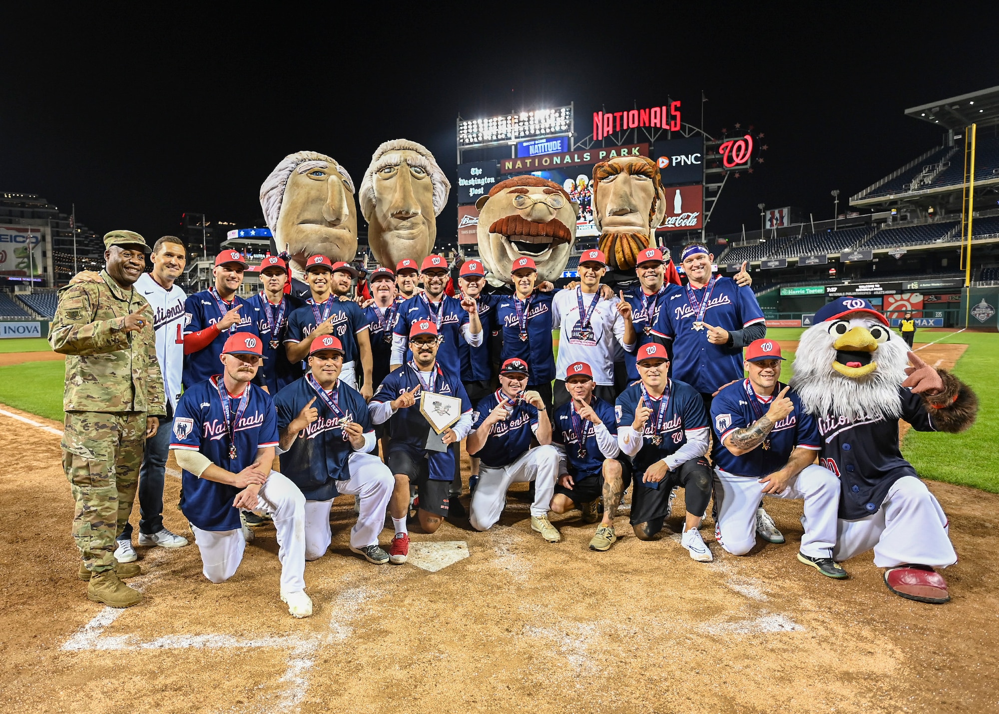 The Joint Base Andrews softball team celebrates their victory over Joint Base Myers-Henderson Hall at Nationals Park in Washington D.C., Oct. 24, 2022.