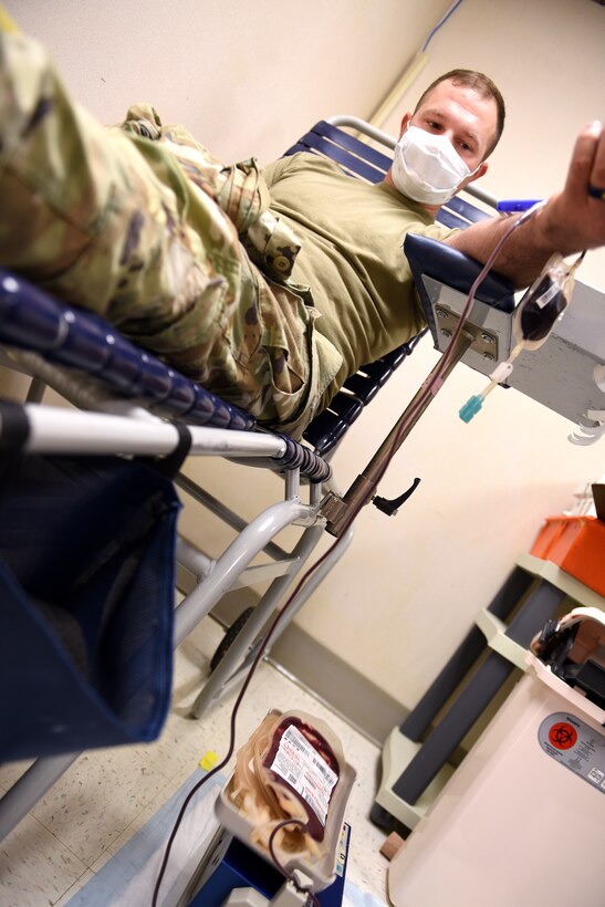 U.S. Army Sgt. Derick Eudy, Military Surface Deployment and Distributions Command, 690th Rapid Port Opening Element mechanic, donates blood during an Armed Services Blood Program blood drive at McDonald Army Health Center, Joint Base Langley-Eustis, Va., Oct. 19, 2022.