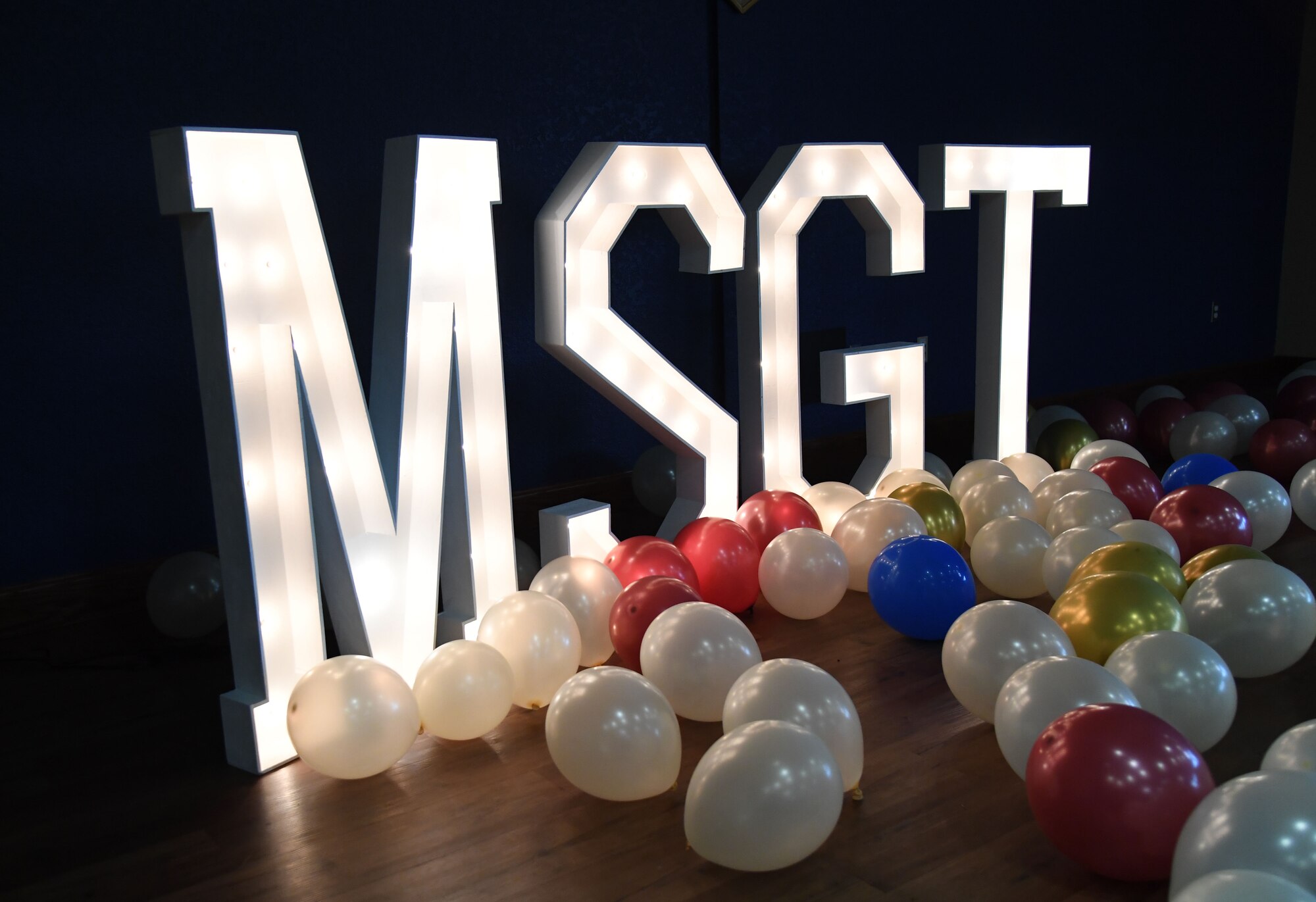 Lighted letters are on display during the Keesler Senior Noncommissioned Officer Recognition Ceremony inside the Bay Breeze Event Center at Keesler Air Force Base, Mississippi, Oct. 21, 2022.