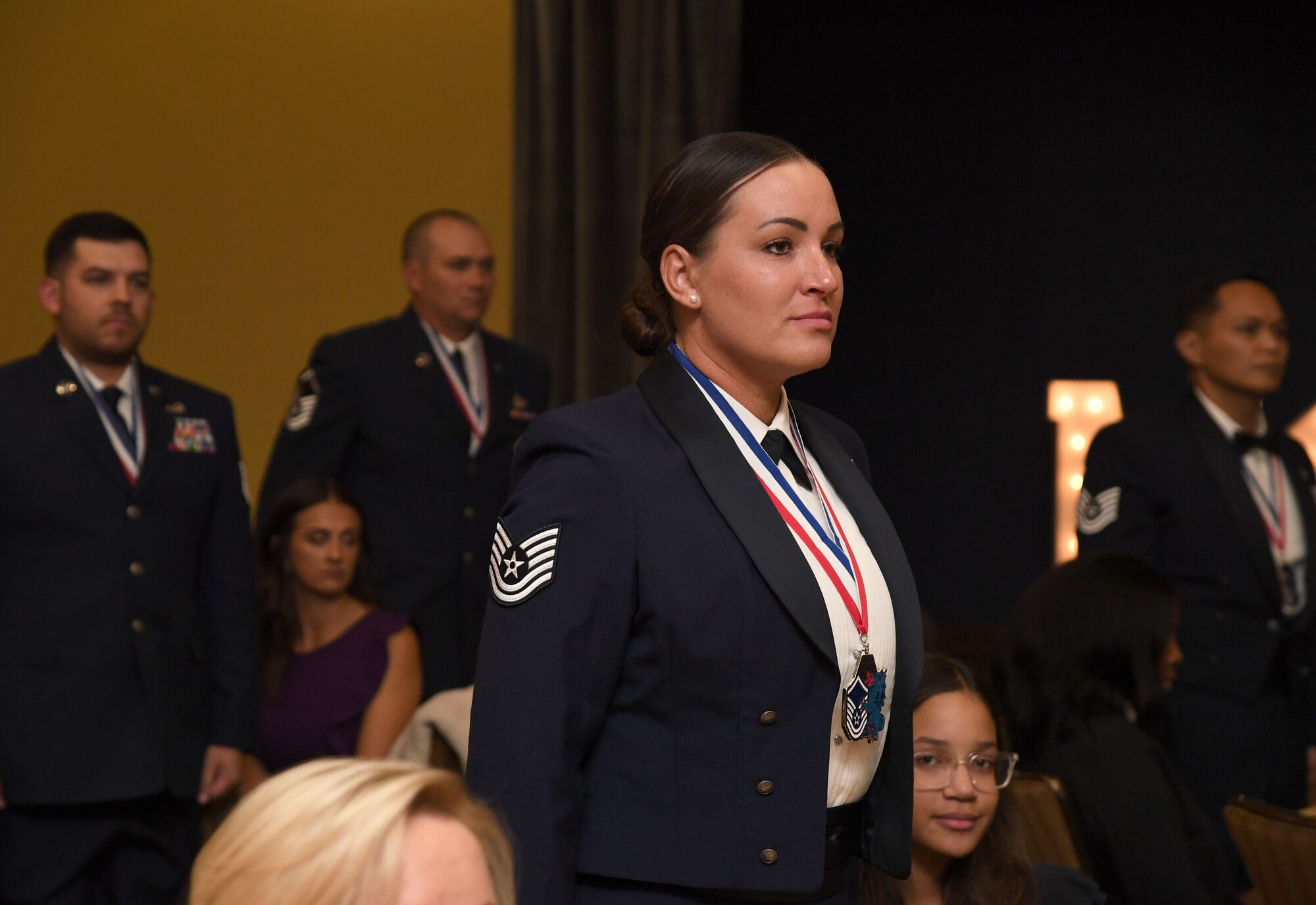 Keesler Senior Noncommissioned Officer promotees stand in recognition during the Keesler Senior NCO Recognition Ceremony inside the Bay Breeze Event Center at Keesler Air Force Base, Mississippi, Oct. 21, 2022.