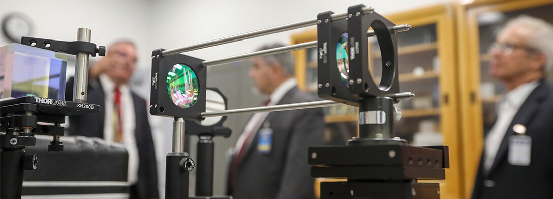 A setup of interferometer components during a tour of the Measurement Science & Technology Laboratory, Naval Surface Warfare Center, Corona Division.