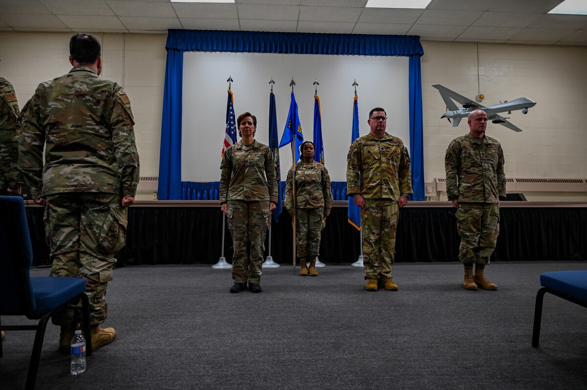 an element of Airmen stand at attention.