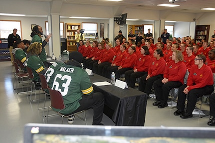 Green Bay Packers running back Aaron Jones answers a question from cadets during a visit to the Wisconsin National Guard Challenge Academy campus at Fort McCoy, Wis., Oct. 18, 2022. The voluntary Challenge Academy program uses a structured military-style environment and state-certified teachers and counselors to reshape the lives of 16-to-18-year-olds at risk of not completing high school.