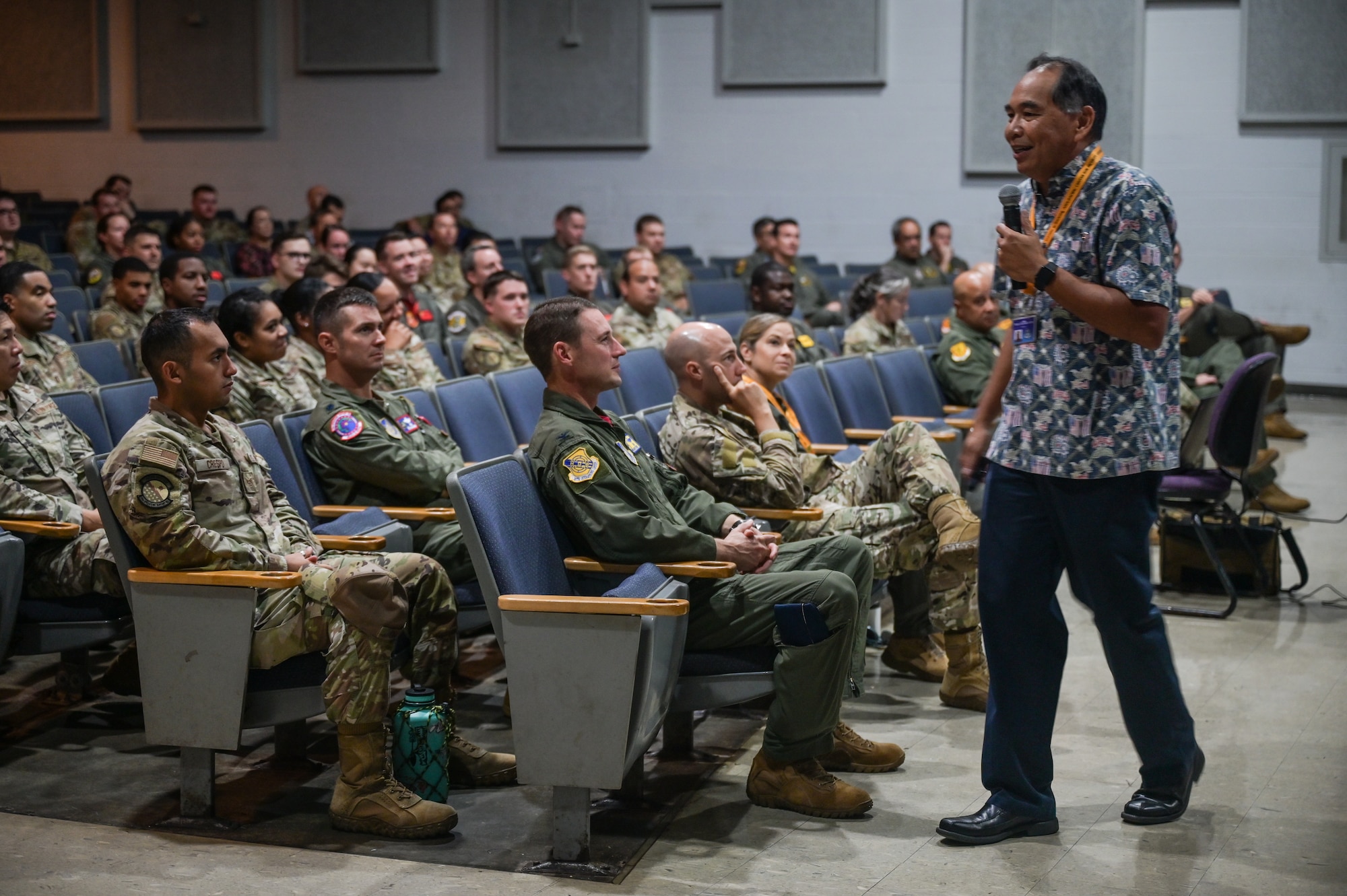 U.S. Navy Rear Admiral (Ret.) Peter Gumataotao, Daniel K. Inouye Asia-Pacific Center for Security Studies director, speaks to Airmen assigned to Joint Base Pearl Harbor-Hickam during a Professional Development event  hosted by the 15th Operations Group at the Hickam Theater on JBPHH, Hawaii, Oct. 21, 2022. The hour-long presentation was open to all of JBPHH to expand their knowledge on Geopolitical Megatrends and Regional Pressure Points within the Indo-Pacific theater. (U.S. Air Force photo by Staff Sgt. Alan Ricker)