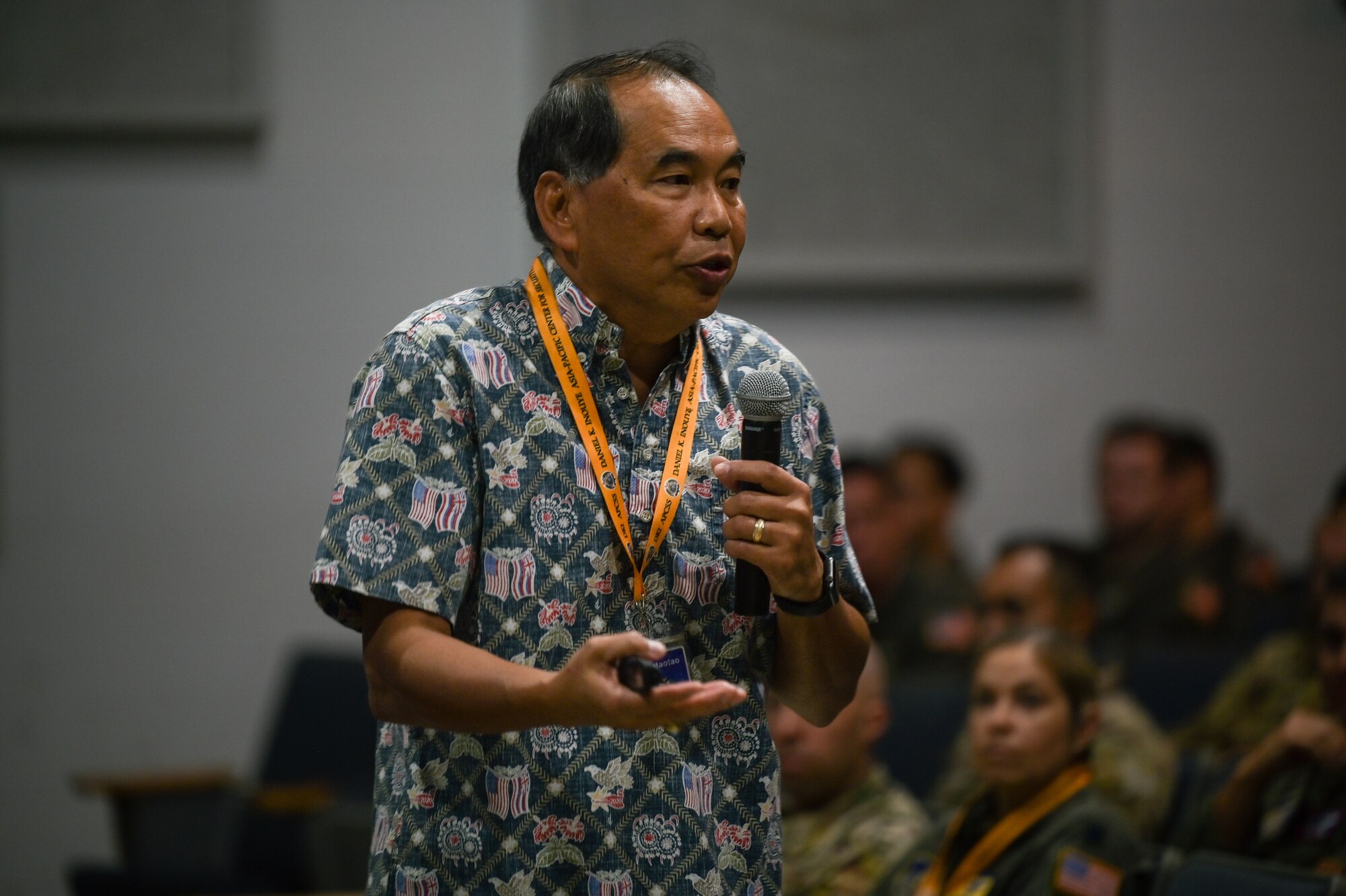 U.S. Navy Rear Admiral (Ret.) Peter Gumataotao, Daniel K. Inouye Asia-Pacific Center for Security Studies director, speaks to Airmen assigned to Joint Base Pearl Harbor-Hickam during a Professional Development event  hosted by the 15th Operations Group at the Hickam Theater on JBPHH, Hawaii, Oct. 21, 2022. Gumataotao briefed about Geopolitical Megatrends and Regional Pressure Points within the Indo-Pacific theater. (U.S. Air Force photo by Staff Sgt. Alan Ricker)