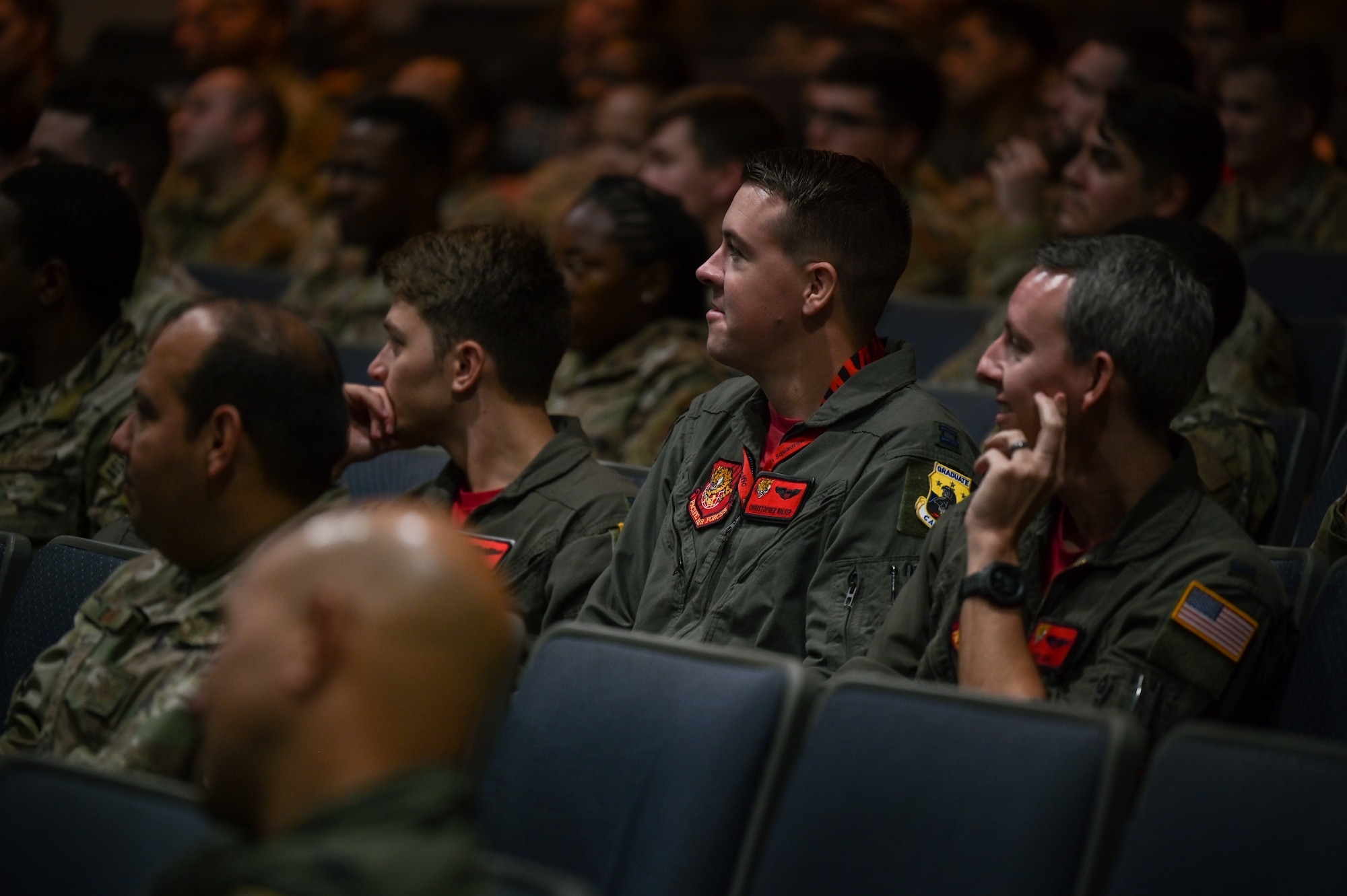 Pilots assigned to the 535th Airlift Squadron attend a 15th Operations Group Professional Development event at the Hickam Theater on Joint Base Pearl Harbor-Hickam Hawaii, Oct. 21, 2022.Gumataotao briefed about Geopolitical Megatrends and Regional Pressure Points within the Indo-Pacific theater. (U.S. Air Force photo by Staff Sgt. Alan Ricker)