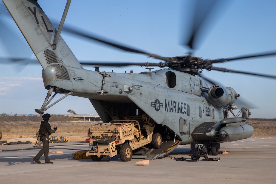 MARINE CORPS BASE CAMP PENDLETON (Aug. 31, 2022) - U.S. Marine Corps Sgt. Peter Grasso, an aviation communications system technician with 3rd Low Altitude Air Defense, 13th Marine Expeditionary Unit, off loads an MRZR from a CH-53E Super Stallion during forward arming and refueling point (FARP) operations, Aug. 31. The Navy-Marine Corps team, capable of both rapid response and sustained operations globally, remains America's most persistent and versatile military instrument . Marines and Sailors of the 13th MEU are embarked aboard the Makin Island Amphibious Ready Group (ARG) conducting integrated training operations in U.S. 3rd Fleet. (U.S. Marine Corps photo by Cpl. Atehortua)