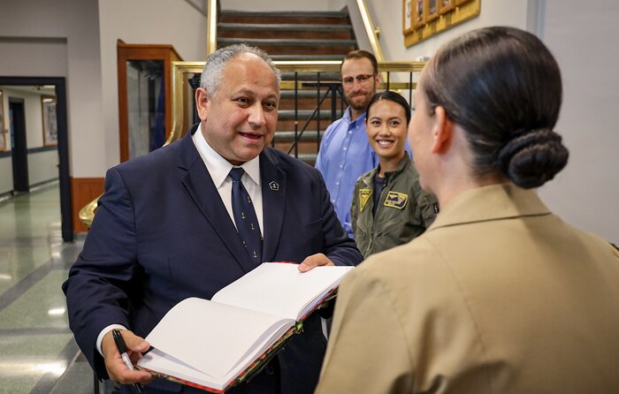 Secretary of the Navy Carlos Del Toro speaks with Sailors during a tour of the Naval Aviation Schools Command onboard Naval Air Station (NAS) Pensacola Oct. 13, 2022.