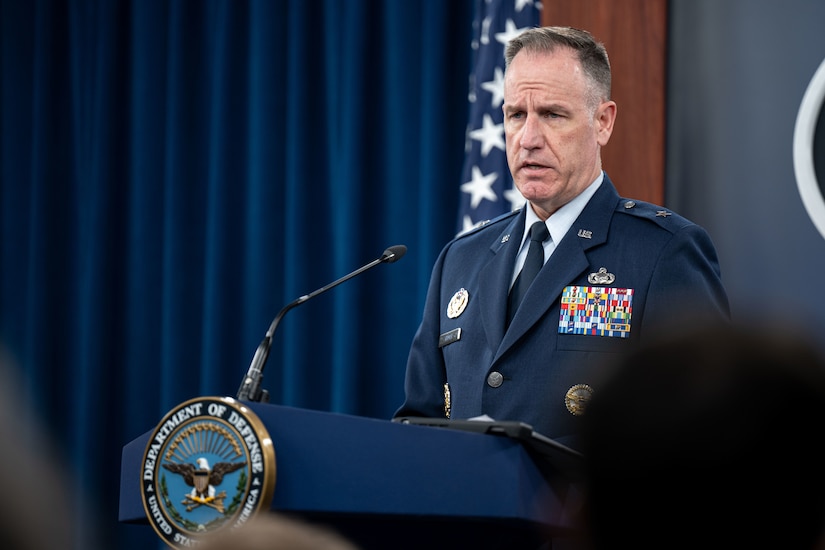 A man speaks from a podium.