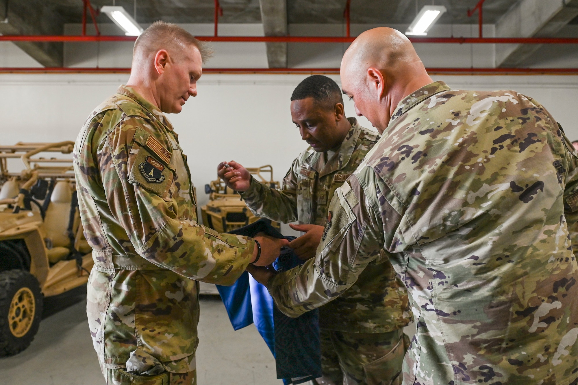 U.S. Air Force Staff Sgt. Nicholas Greene, the noncommissioned officer in charge of administration assigned to the 36th Contingency Response Squadron, signs the official Linebacker of the Week jersey at Andersen Air Force Base, Guam, Oct. 20, 2022. The Team Andersen Linebacker of the Week recognizes outstanding enlisted, officer, civilian and total force personnel who have had an impact on achieving Team Andersen’s mission, vision and priorities. (U.S. Air Force photo by Airman 1st Class Breanna Christopher Volkmar)