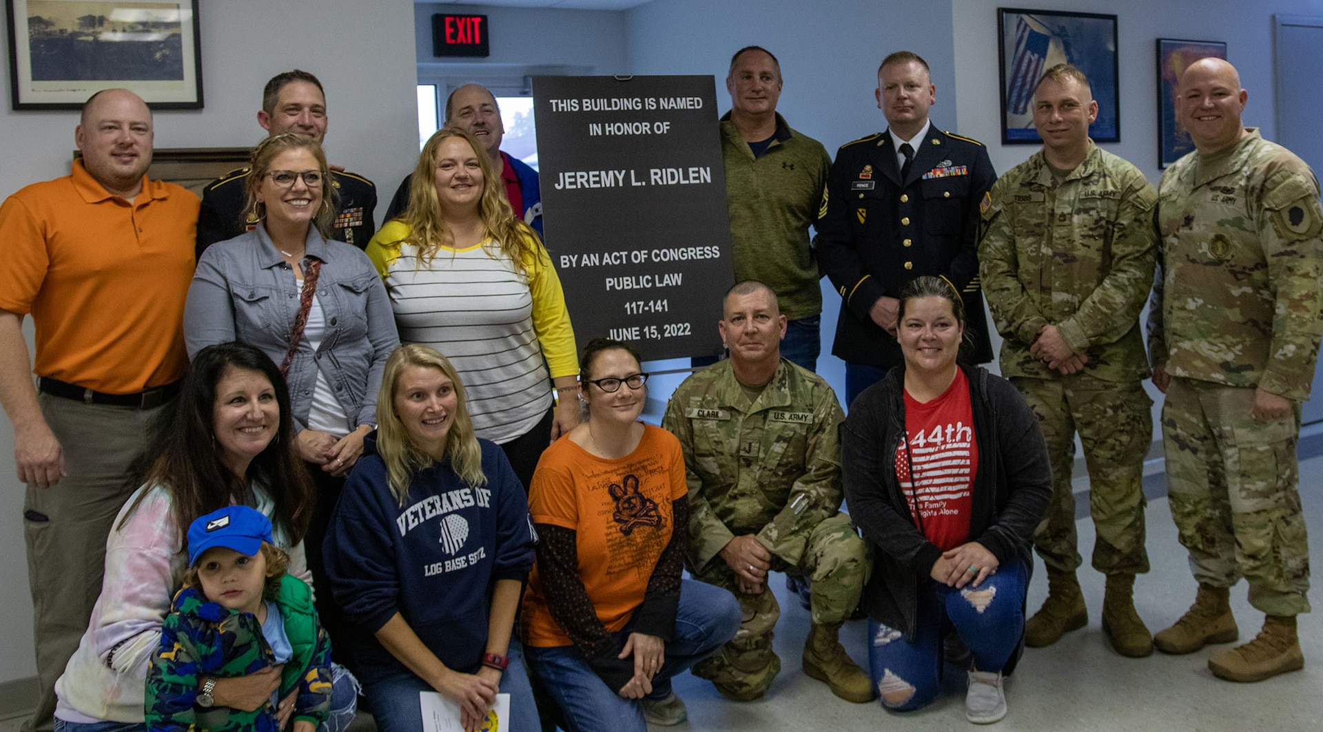 Members and veterans of the 1544th Transportation Company who served with Illinois Army National Guard Spc. Jeremy Ridlen gather at the dedication ceremony of the Jeremy Ridlen Post Office at the Maroa, Illinois, Fire Department Oct. 25. Ridlen was killed in action May 23, 2004 in Iraq.