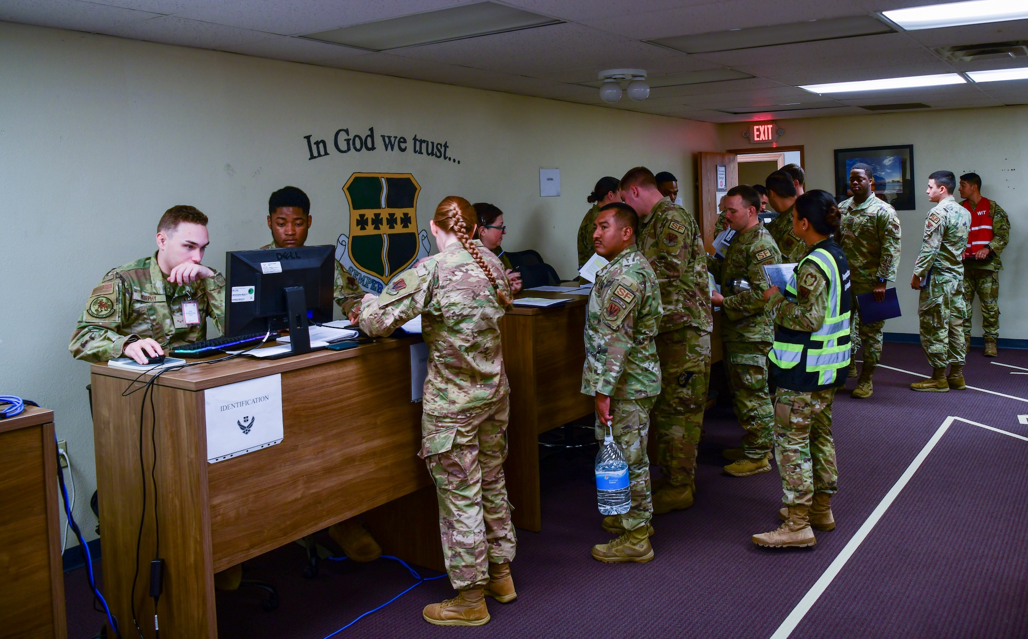 Airmen process papers during an exercise