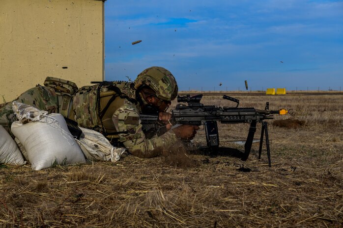 A 9th Security Forces Airmen provide suppressive fire to defend the area
