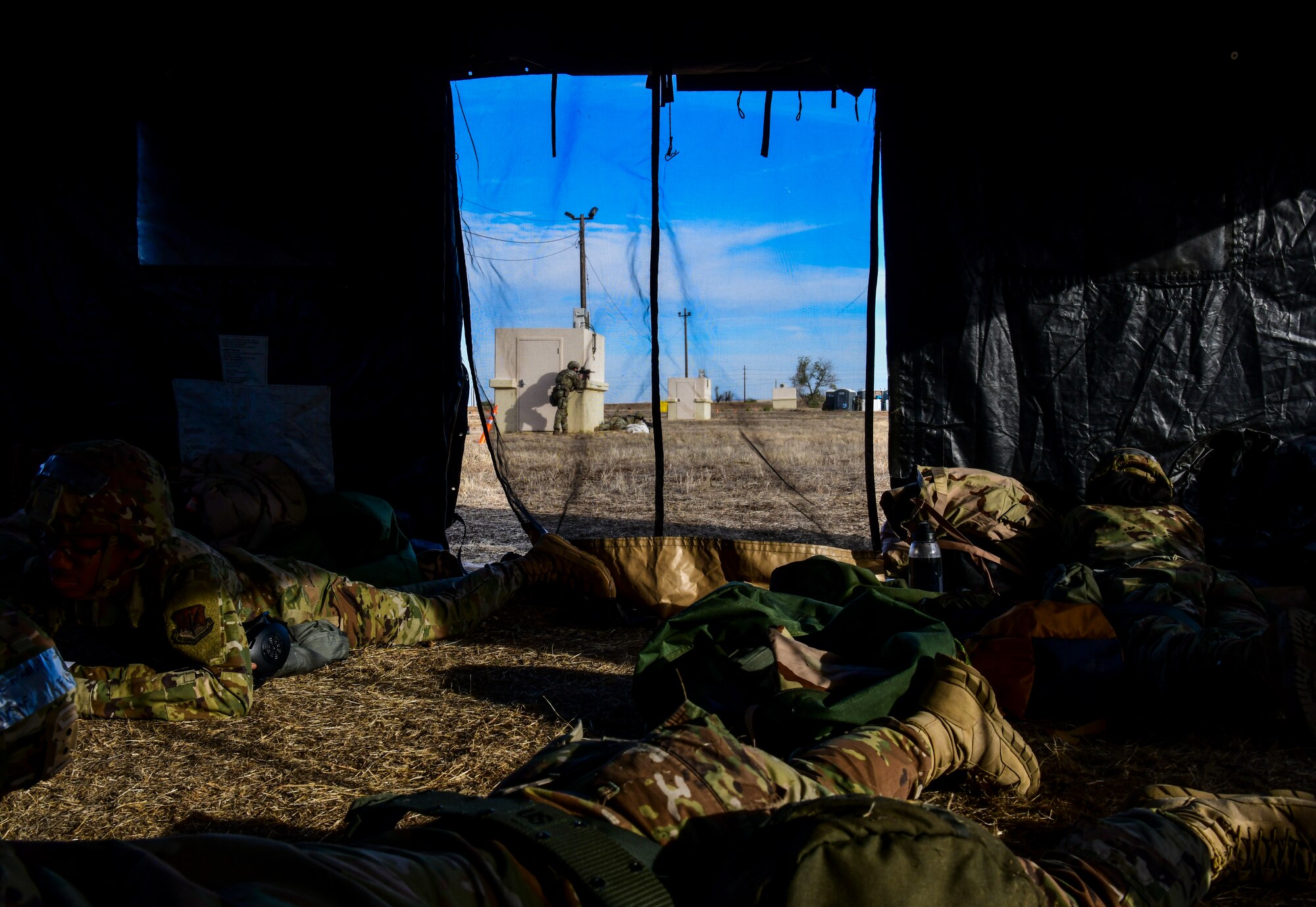 Airmen from the 9th Force Support Squadron take cover while 9th Security Forces Airmen work together to defend the area