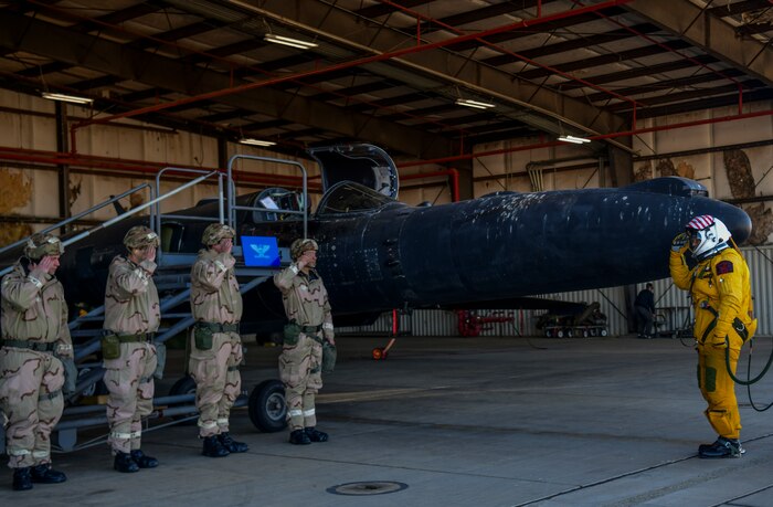 A U-2 Dragon Lady pilot salutes the aircrew before 
 take off