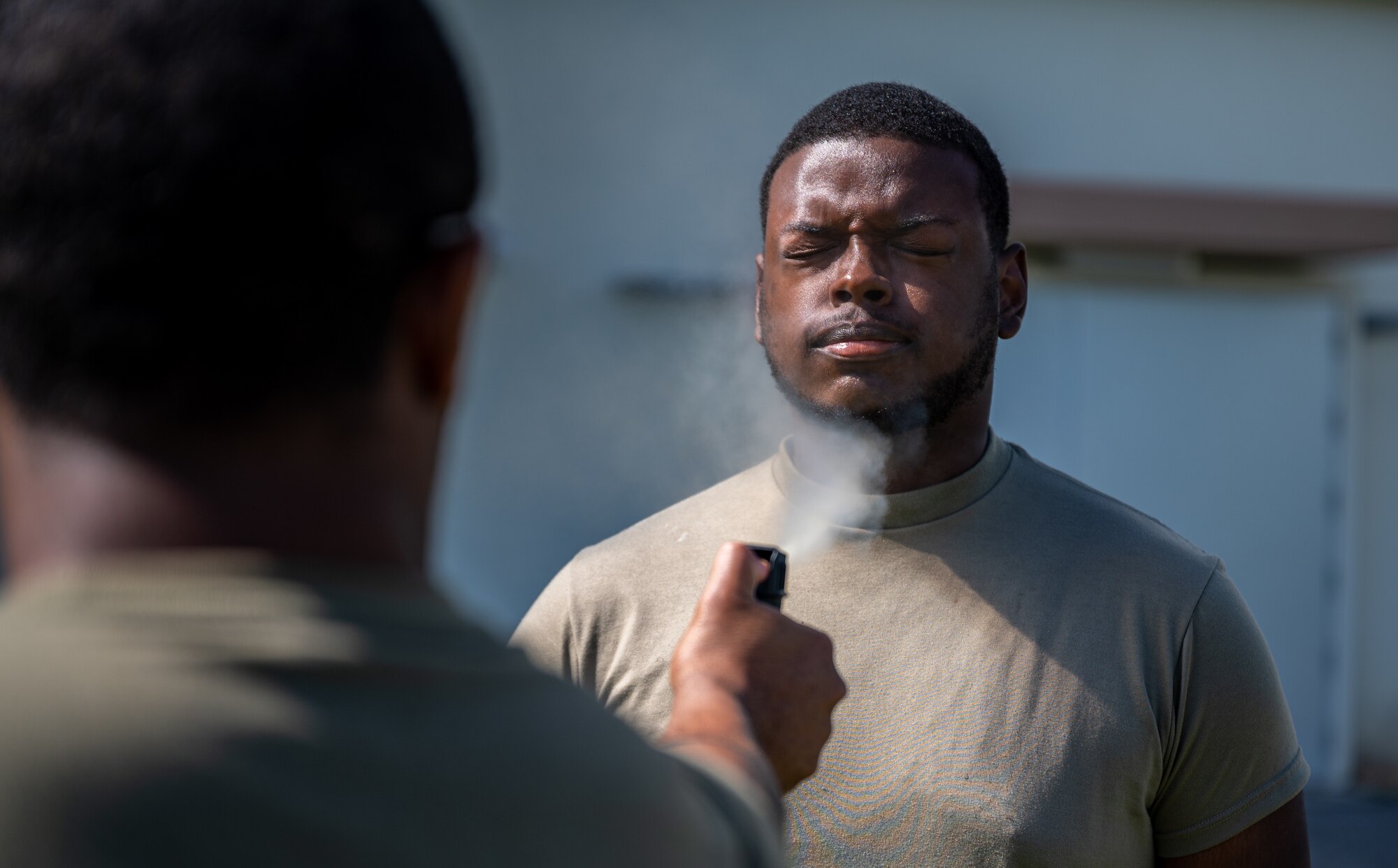 Airman gets sprayed with OC spray.
