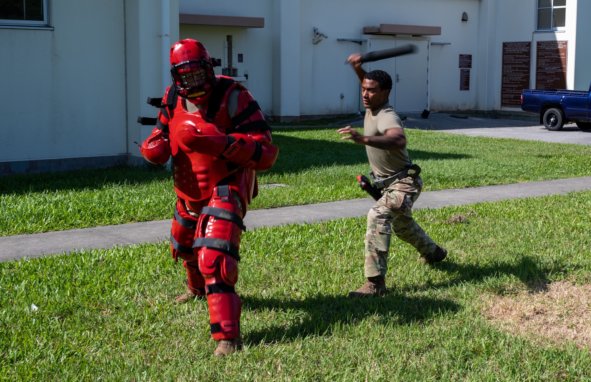 Airman swings baton.