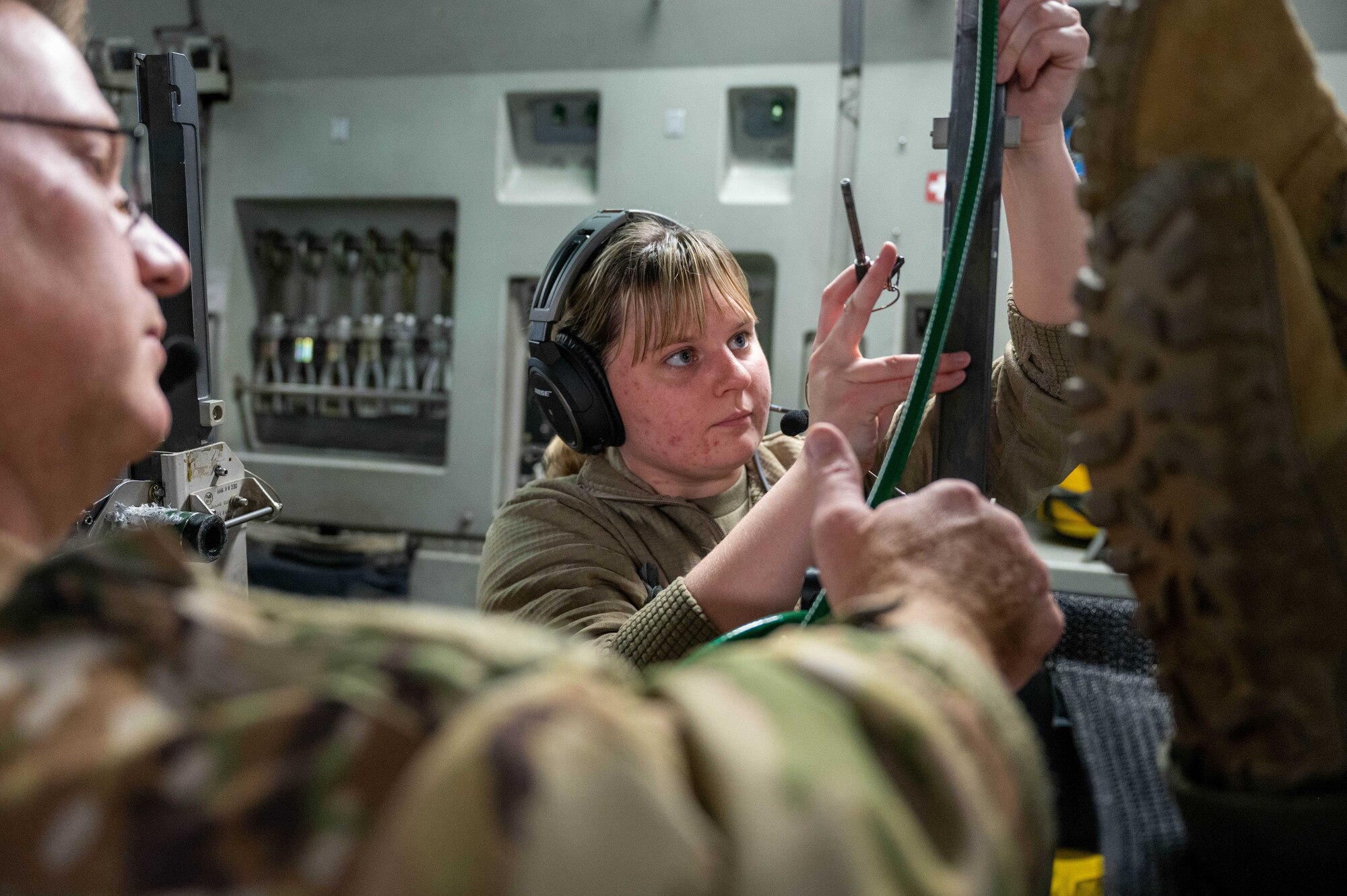 Senior Airman Taylor Sturgell, an aeromedical evacuation technician with the 934th Aeromedical Evacuation Squadron, connects an oxygen hose for an in-flight patient during an exercise at Minneapolis St. Paul International Airport Air Reserve Station, October 21, 2022. The exercise was planned and executed to test interoperabilty of international joint forces. (U.S. Air Force photo by Master Sgt. Trevor Saylor)