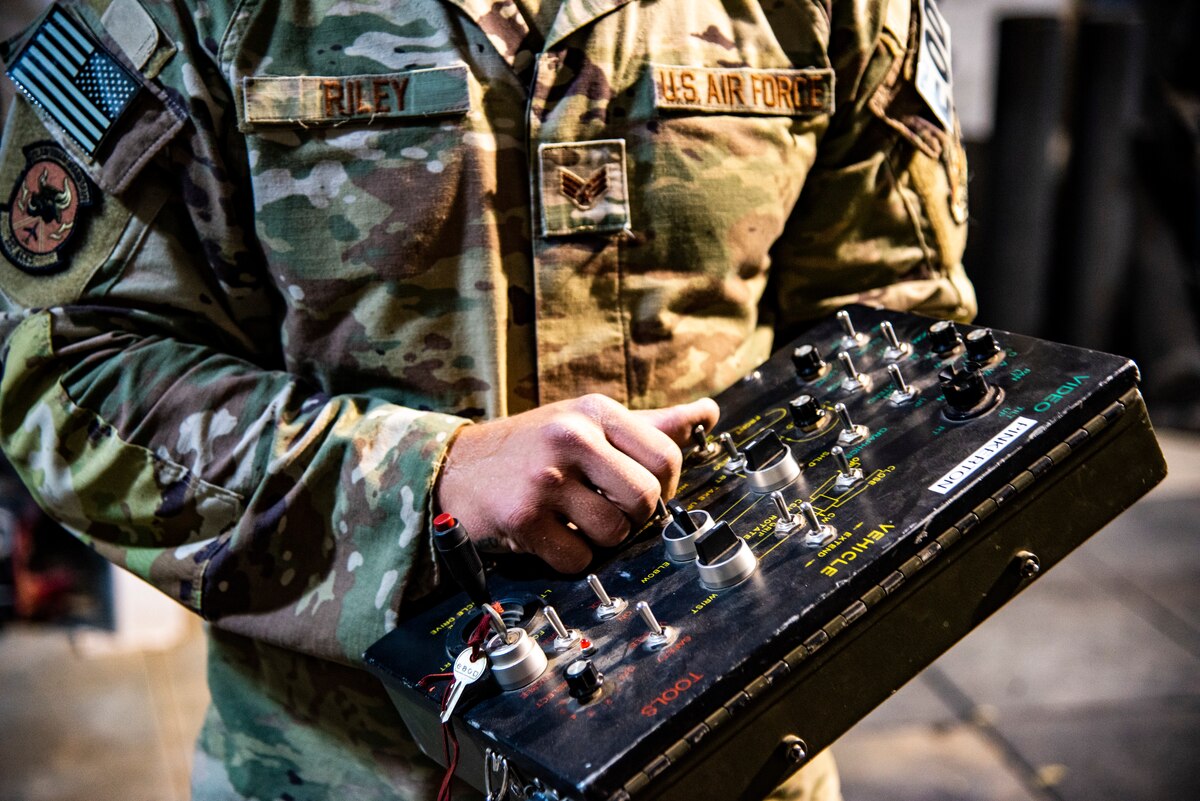 Senior Airman Kyle Riley, 332d Expeditionary Civil Engineering Squadron Explosive Ordnance Disposal Logistics Technician, operates an Andros F6A remotely-controlled robot at an undisclosed location in Southwest Asia, Oct. 14, 2022. Riley was instrumental in arranging repairs for this and other EOD tools, enhancing his unit's ability to respond to explosive threats. (U.S. Air Force photo by: Tech. Sgt. Jim Bentley)