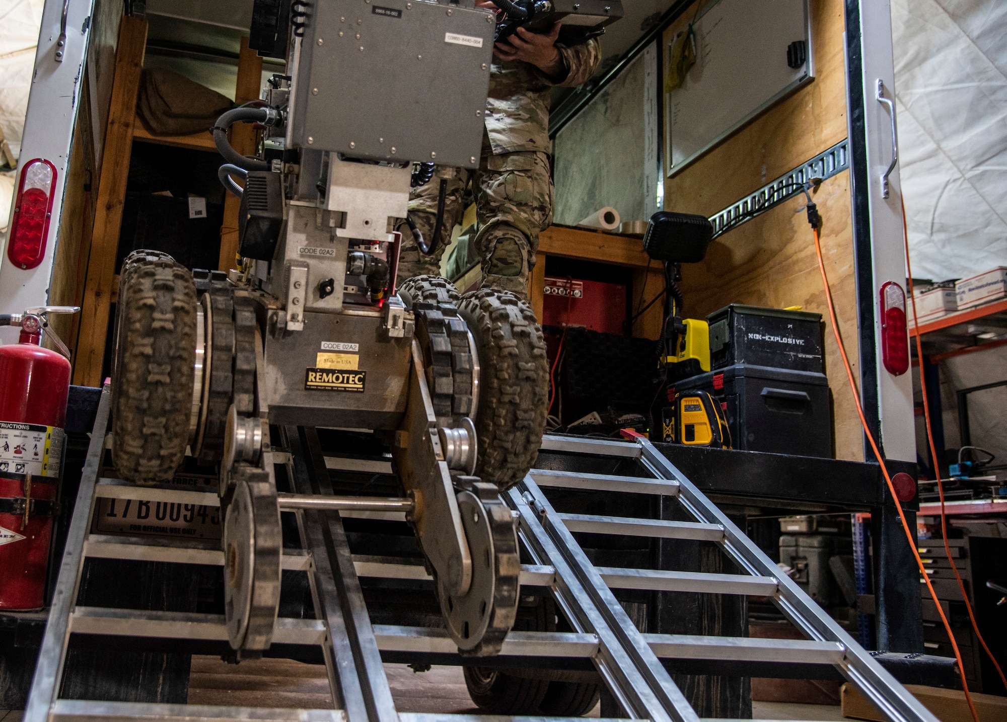 Senior Airman Kyle Riley, 332d Expeditionary Civil Engineering Squadron Explosive Ordnance Disposal Logistics Technician, operates an Andros F6A remotely-controlled robot at an undisclosed location in Southwest Asia, Oct. 14, 2022. Riley was instrumental in arranging repairs for this and other EOD tools, enhancing his unit's ability to respond to explosive threats. (U.S. Air Force photo by: Tech. Sgt. Jim Bentley)