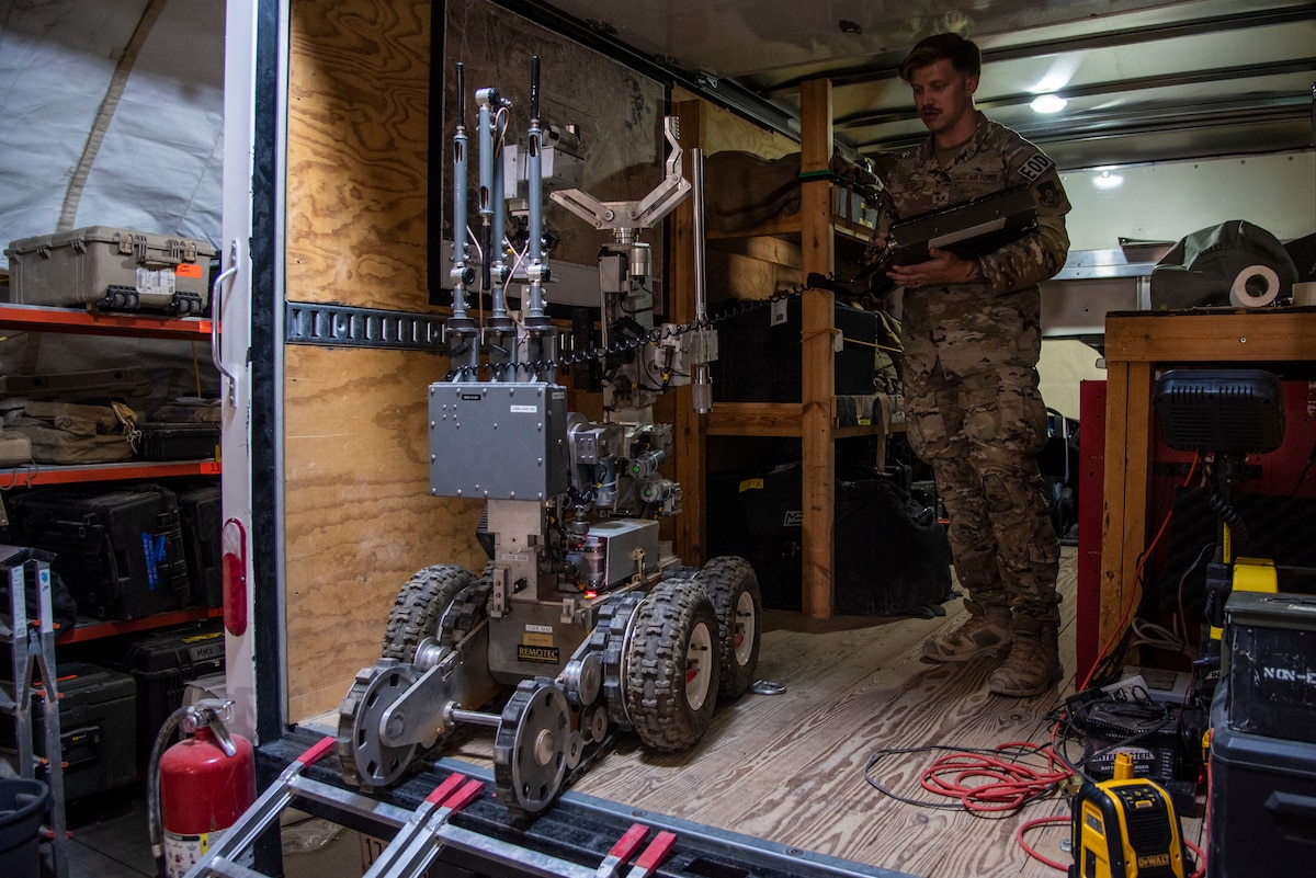 Senior Airman Kyle Riley, 332d Expeditionary Civil Engineering Squadron Explosive Ordnance Disposal Logistics Technician, operates an Andros F6A remotely-controlled robot at an undisclosed location in Southwest Asia, Oct. 14, 2022. Riley was instrumental in arranging repairs for this and other EOD tools, enhancing his unit's ability to respond to explosive threats. (U.S. Air Force photo by: Tech. Sgt. Jim Bentley)