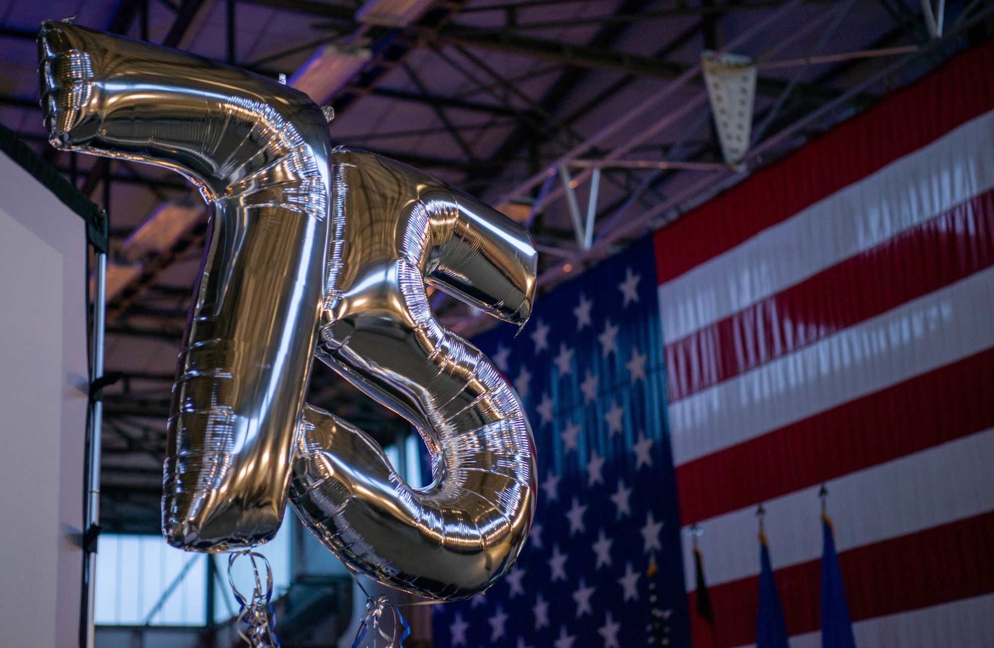 Balloons float in a hangar