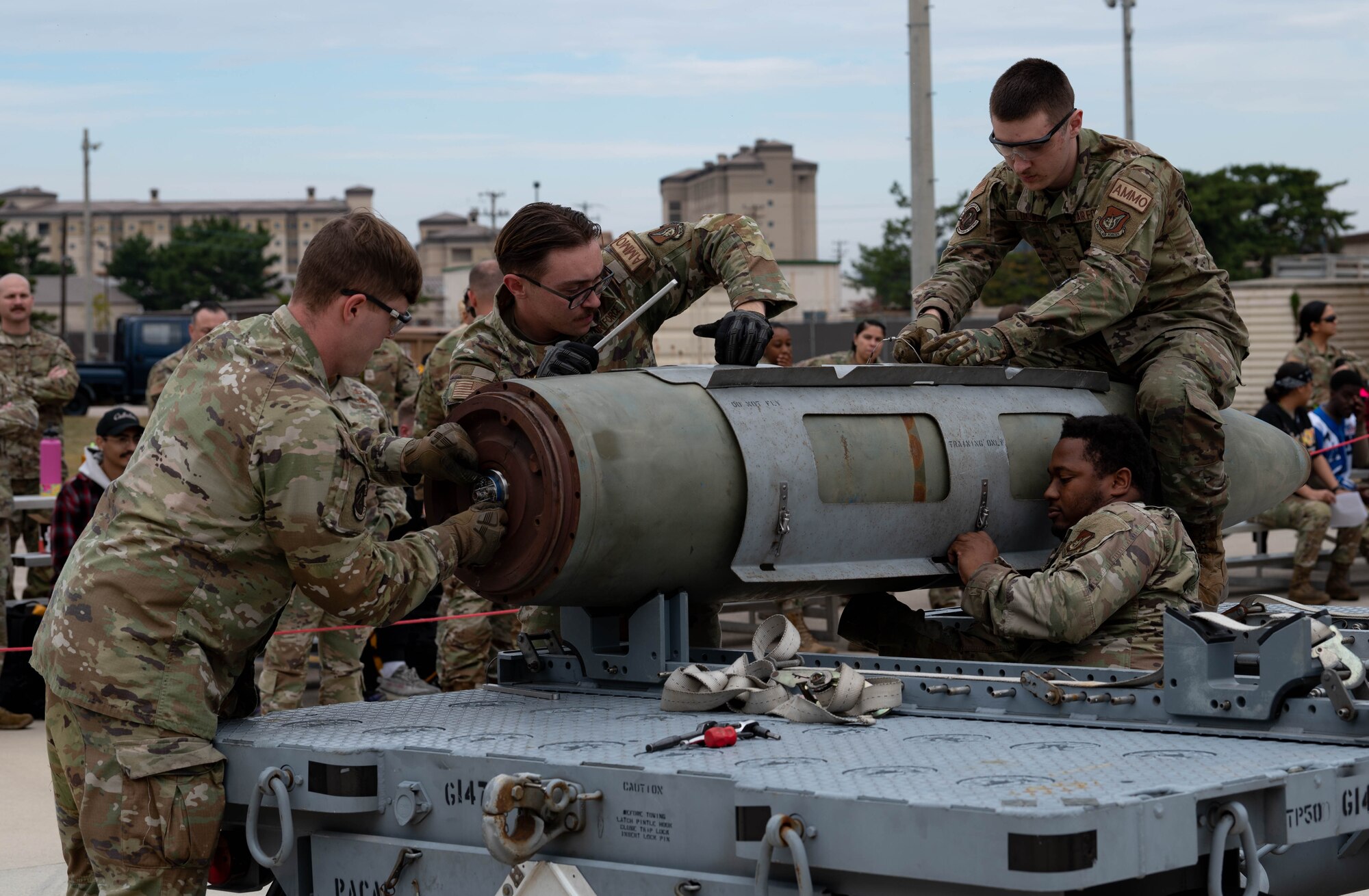35th Fighter Generation Squadron team members assemble a GBU-38 bomb