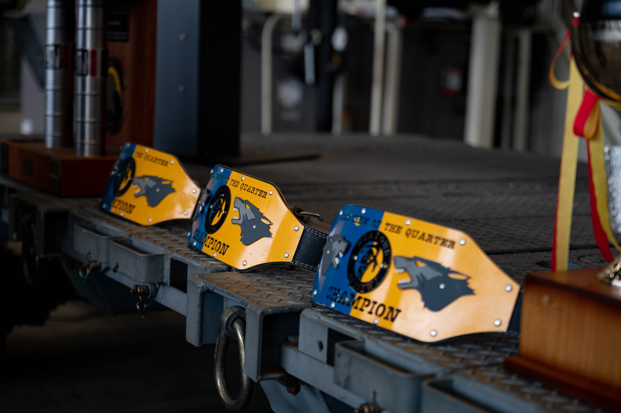Several championship belts are displayed during the 3rd Quarter Load Crew Competition