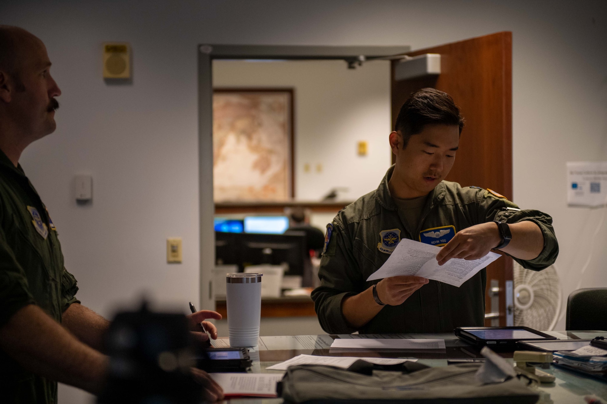 Capt. Kevin Yoo, 3rd Airlift Squadron pilot, reads flight procedures before a local training flight at Dover Air Force Base, Delaware, Oct. 24, 2022. Airmen from the 3rd AS routinely fly training missions on C-17 Globemaster IIIs to rehearse global support. (U.S. Air Force photo by Senior Airman Faith Barron)