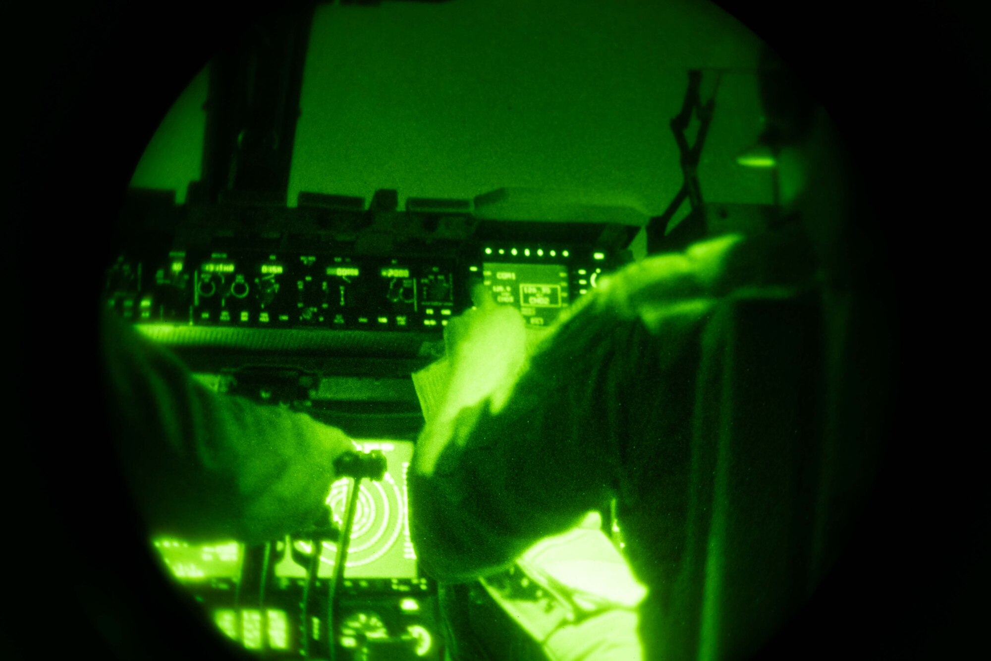 Capt. Benjamin Bertelson, 3rd Airlift Squadron aircraft commander, changes radio frequencies during a local training flight aboard a C-17 Globemaster III over Delaware, Oct. 24, 2022. The 3rd AS provides global support through delivery of time-critical assets including cargo and people. The squadron routinely flies training missions to stay ready for global airlift. (U.S. Air Force photo by Senior Airman Faith Barron)
