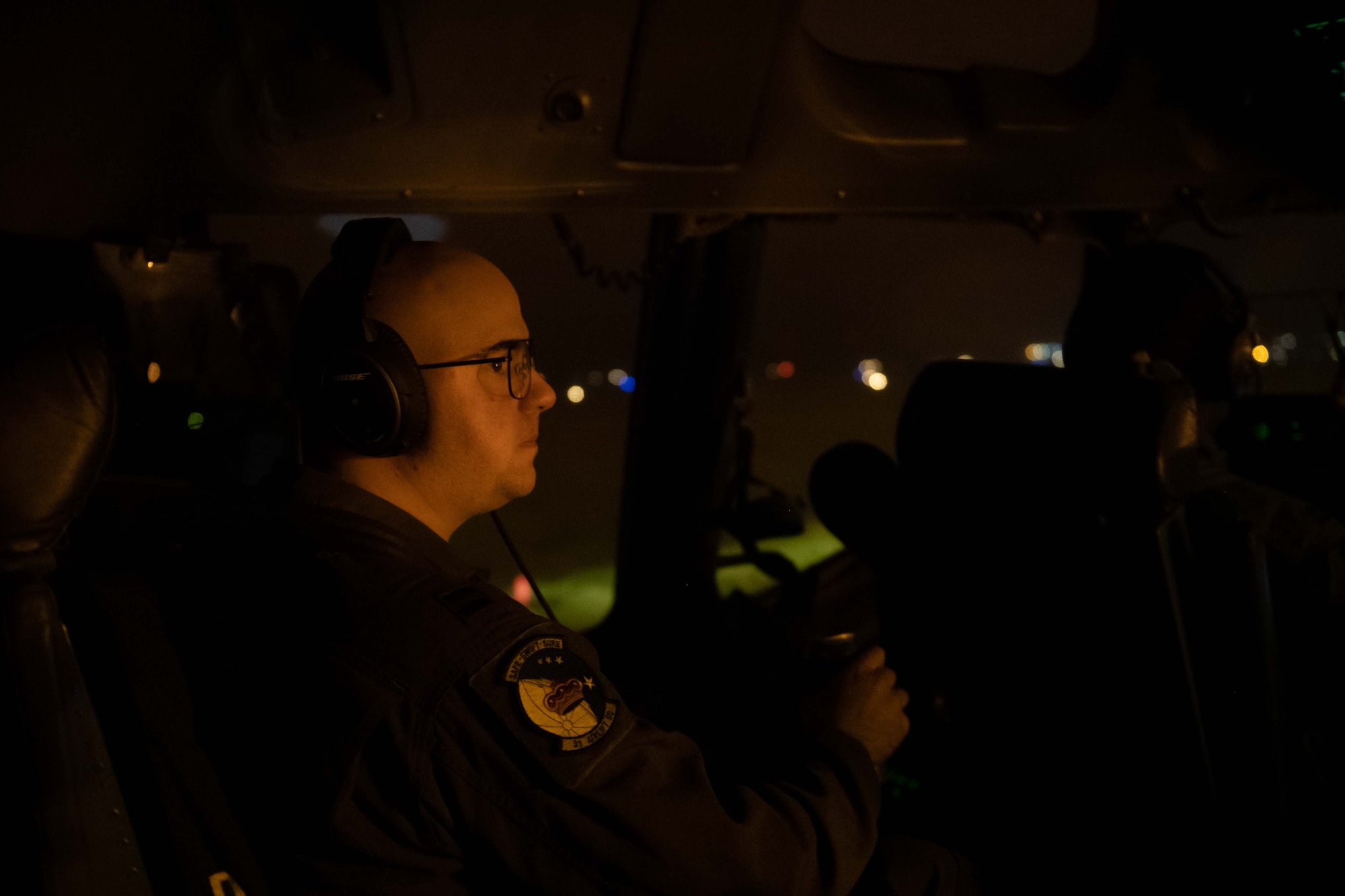 Capt. Shyler Talton, 3rd Airlift Squadron pilot, overlooks the flight deck of a C-17 Globemaster III during a local training flight at Dover Air Force Base, Delaware, Oct. 24, 2022. The 3rd AS operates Dover AFB’s C-17s to fulfill worldwide air mobility requirements. (U.S. Air Force photo by Senior Airman Faith Barron)