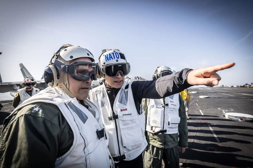 NATO Secretary General Jens Stoltenberg observes flight deck operations aboard the US aircraft carrier USS George H.W. Bush which is currently participating in NATO’s Neptune Strike deployment in the Mediterranean Sea.