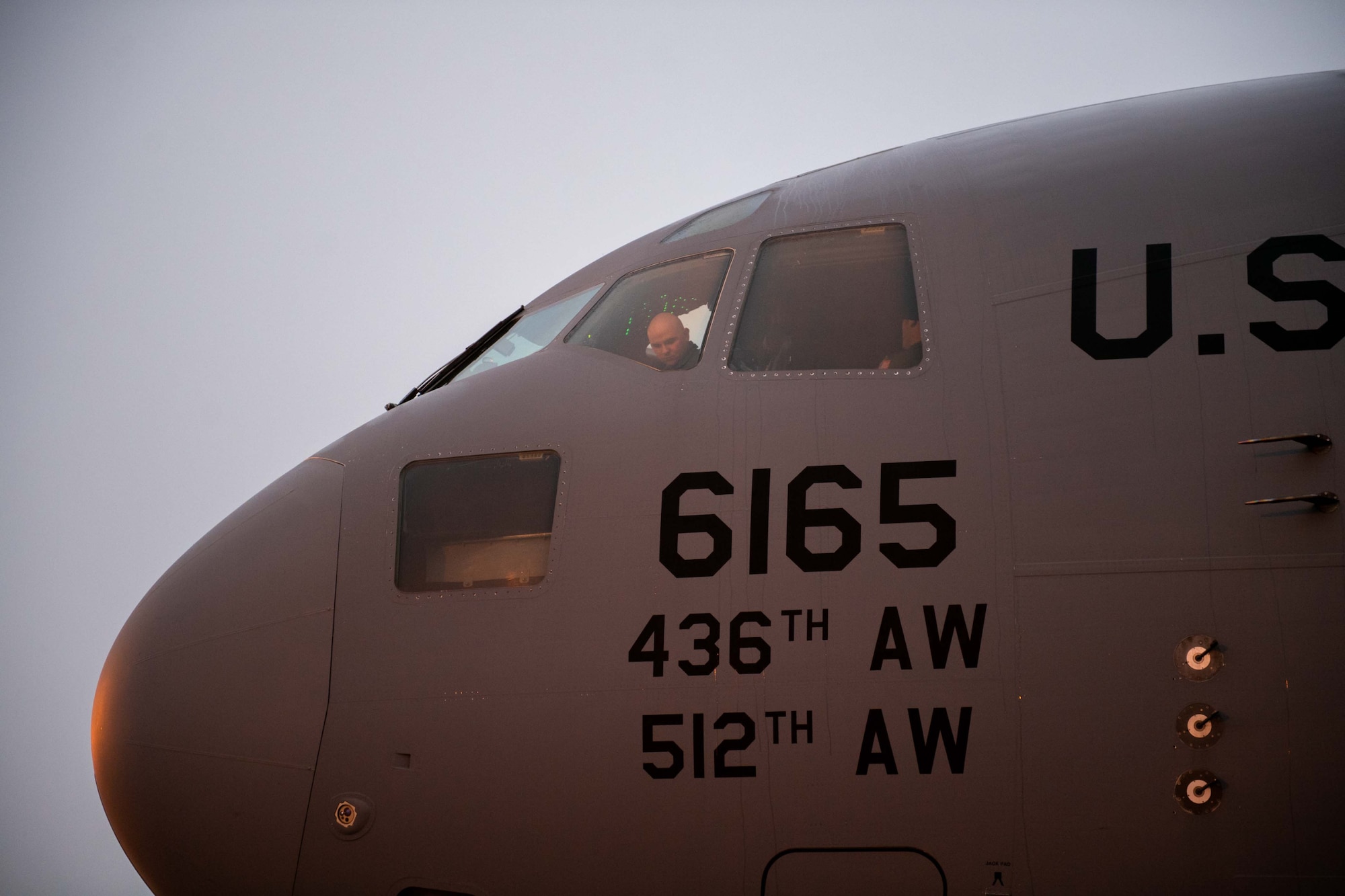 Capt. Shyler Talton, 3rd Airlift Squadron pilot, looks out from the flight deck of a C-17 Globemaster III in preparation for a local training flight at Dover Air Force Base, Delaware, Oct. 24, 2022. The 3rd AS operates Dover AFB’s C-17s to fulfill worldwide air mobility requirements. (U.S. Air Force photo by Senior Airman Faith Barron)