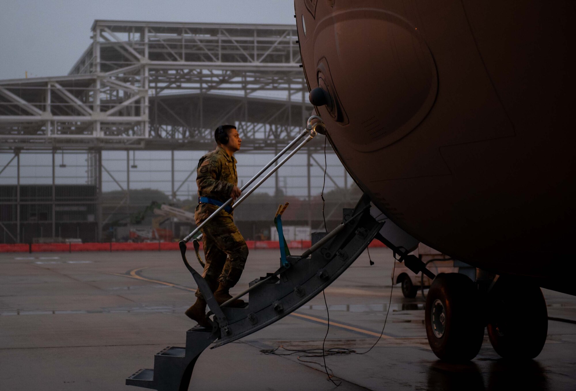 Tech. Sgt. Jeremy Aiumu, 736th Aircraft Maintenance Squadron expeditor, steps aboard a C-17 Globemaster III at Dover Air Force Base, Delaware, Oct. 24, 2022. The 736th AMXS maintains and supports Dover AFB’s C-17s to fulfill worldwide air mobility requirements. (U.S. Air Force photo by Senior Airman Faith Barron)