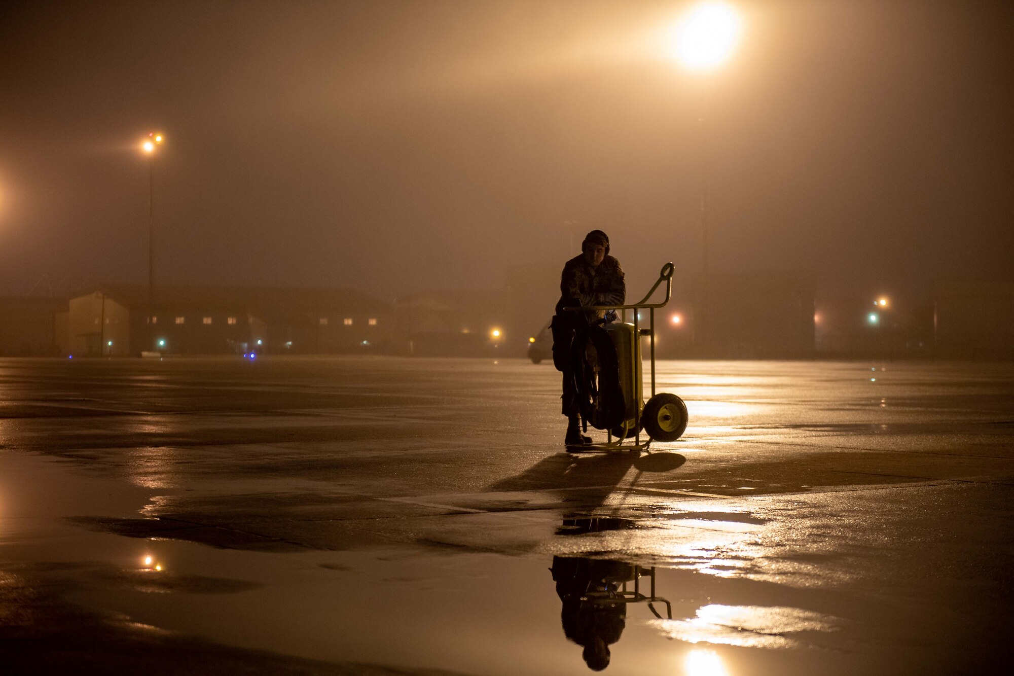 A crew chief from the 736th Aircraft Maintenance Squadron awaits the takeoff of a C-17 Globemaster III at Dover Air Force Base, Delaware, Oct. 24, 2022. The 736th AMXS maintains and supports Dover AFB’s C-17s to fulfill worldwide air mobility requirements. (U.S. Air Force photo by Senior Airman Faith Barron)