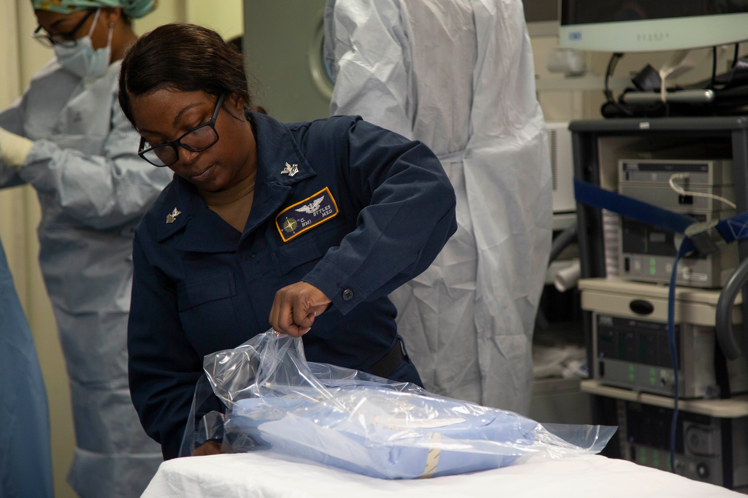 Hospital Corpsman 1st Class Cassandra Styles, from Oxford, Mississippi, assigned to USS Gerald R. Ford's (CVN 78) dental department, prepares sterile dressing during a mass casualty drill in the ship's operating room, Sept. 20th, 2022. Ford is underway in the Atlantic Ocean conducting carrier qualifications and workups for a scheduled deployment this fall. U.S. Navy photo by Mass Communication Specialist 2nd Class Jackson Adkins)