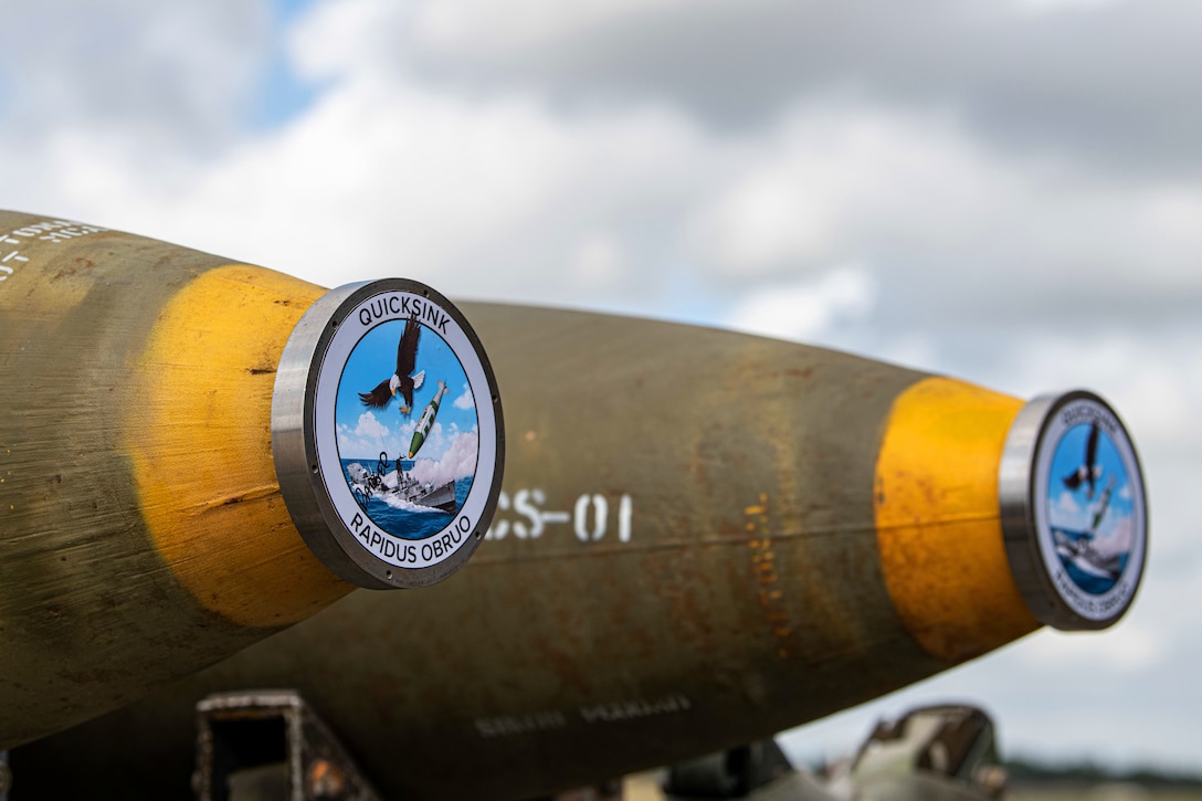 Munitions are laid out in preparation for loading.