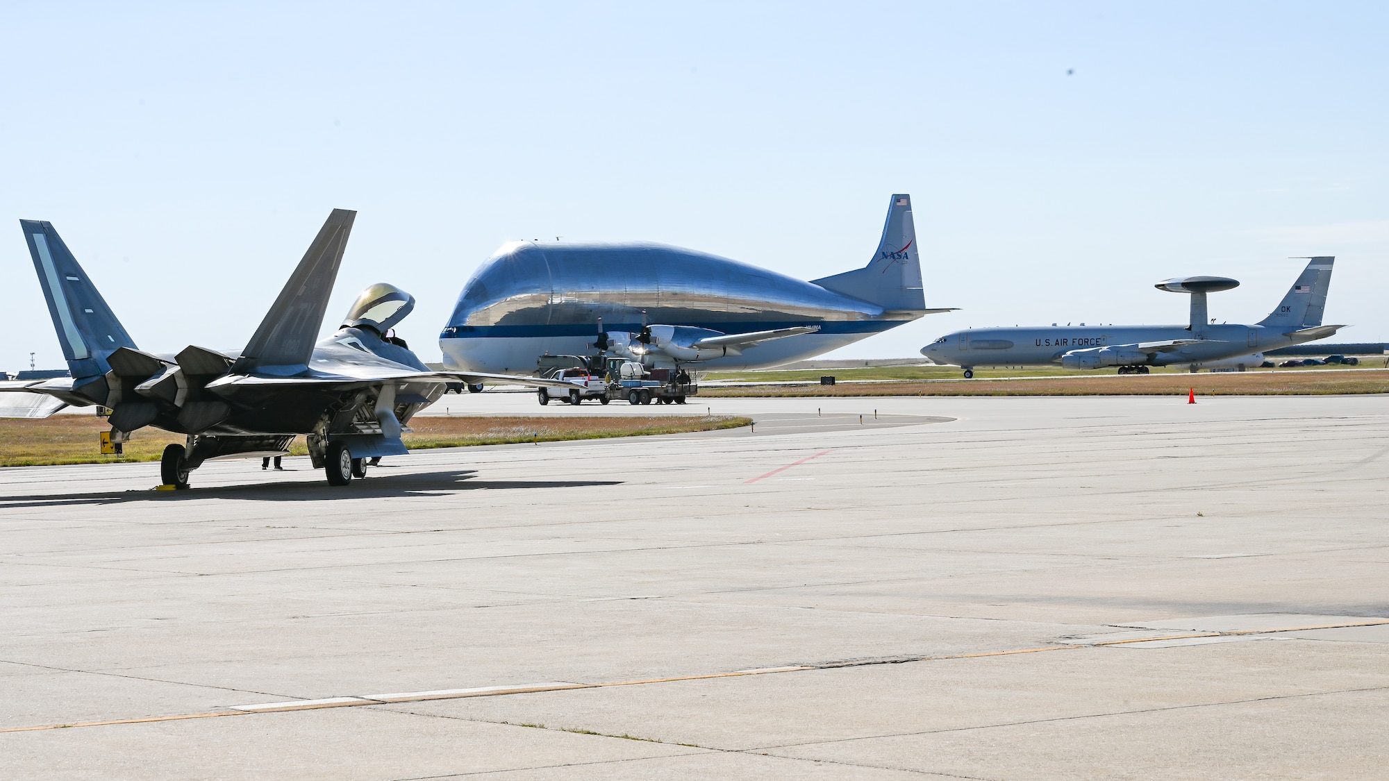 F-22 Raptor aircraft, NASA Super Guppy aircraft and E-3 Sentry aircraft on ramp