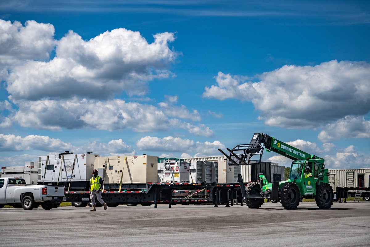 Photo of construction workers operating a forklift