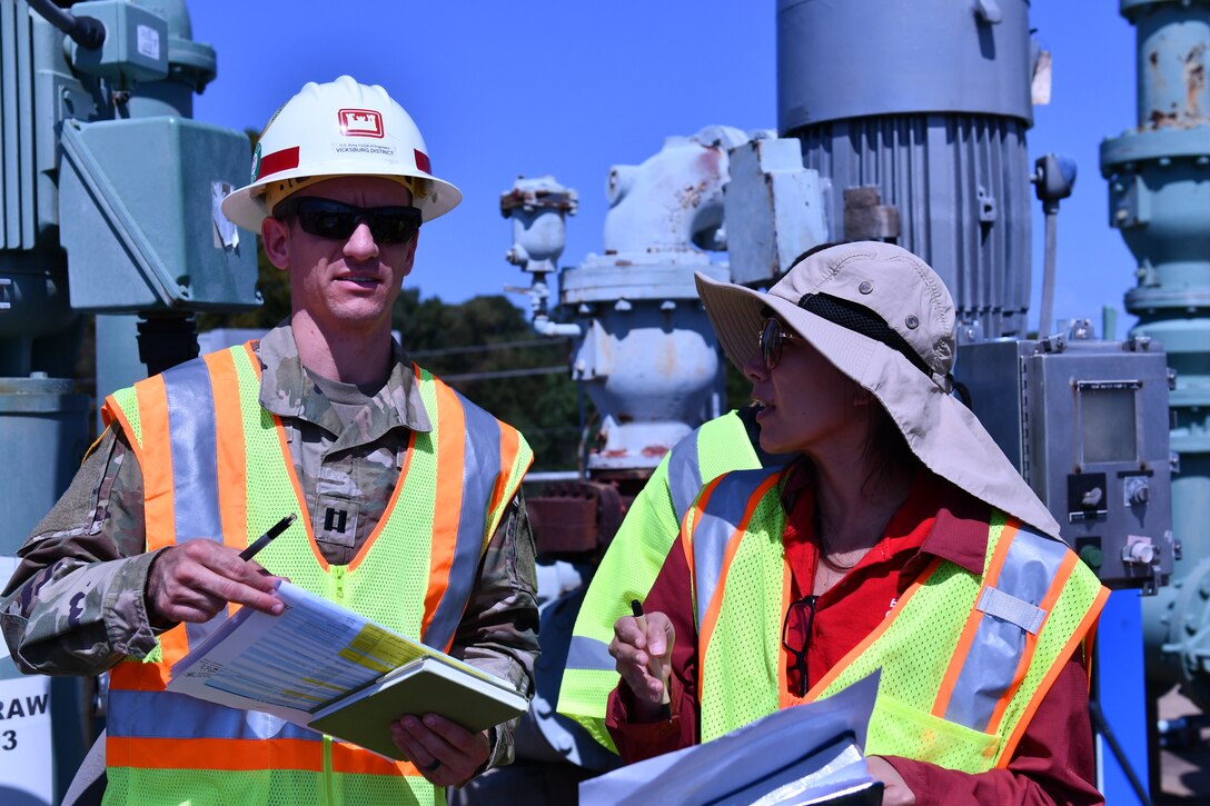 USACE Vicksburg District hydraulic engineer Capt. Hayden Schappell consults with Engineer Research and Development Center (ERDC) research environmental engineer Dr. Edith Martinez-Guerra about interagency assessment efforts at O.B. Curtis Water Treatment Plant in Jackson, Mississippi, on Sept. 26.